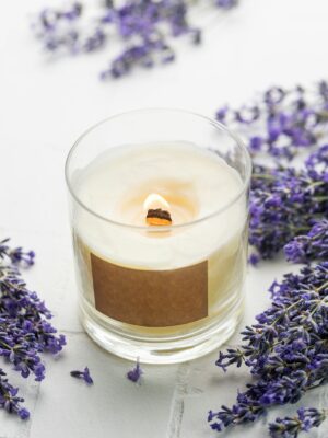 Aroma Candle. Lavender candle on a white tile background.